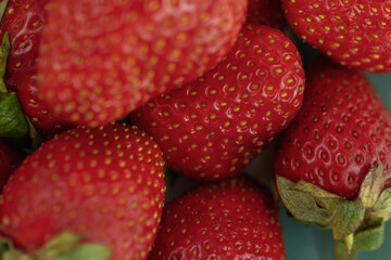 Ripe red strawberries on a plate