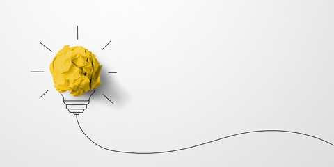 Creative thinking ideas and innovation concept. Paper scrap ball yellow colour with light bulb...