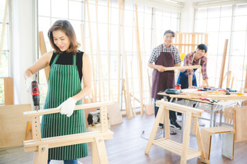 Obraz premium wooden workshop concept, carpenter team craftsman person working with a wood work construction tool