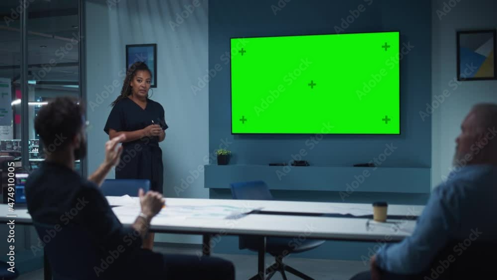 Poster company operations manager holds meeting presentation for a team of executives. multiethnic female u