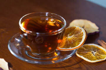 Cup of tea and slices of dried orange