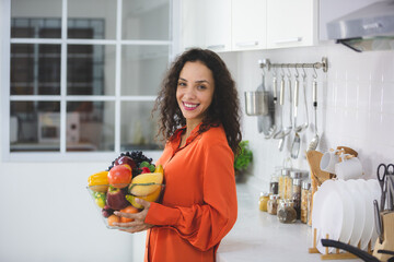 African American woman happy and fun to cooking healthy food in home kitchen, online cook learning