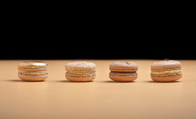 Golden luxury dessert cake macaron on pastel background. Festive desserts. Top view.