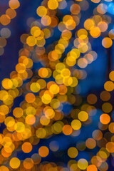 Abstract orange bokeh on a blue background.