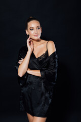 portrait of a beautiful woman in black silk underwear