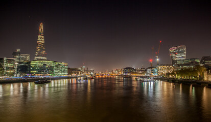 View from The Tower Bridge.The night view of Shard, a 95-storey skyscraper in Southwark, London.It is the glass clad pyramidal tower with 72 habitable floors.