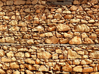 Stone wall texture background with different sized stones