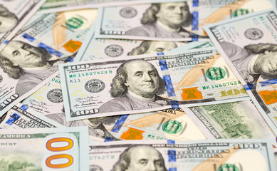 One Hundred Dollar Banknotes are creatively laid out. Money banknotes of US dollars, a lot of different money. Buy printing, banking. Cash income, wealth and financial independence.