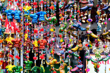 Pune, India, Handicraft items with selective focus, textile and wooden goods with traditional design for sale at Indian Market.