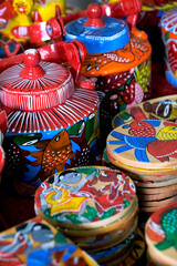 Fototapeta na wymiar Pune, India, Handicraft items with selective focus, textile and wooden goods with traditional design for sale at Indian Market.