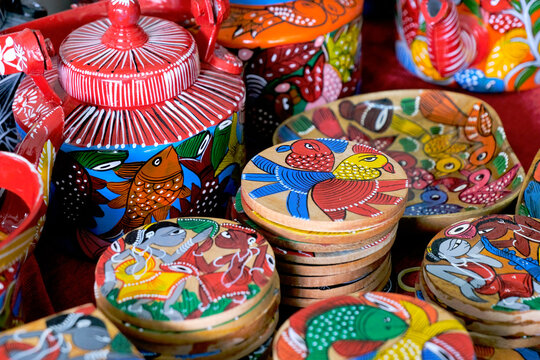 Pune, India, Handicraft items with selective focus, textile and wooden goods with traditional design for sale at Indian Market.
