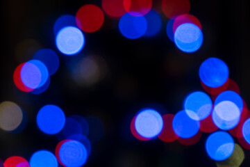 Colorful defocused bokeh lights in blur night background. Abstract circular bokeh background of Christmaslight