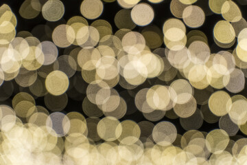 abstract holiday background. bokeh christmas. defocused gold lights.