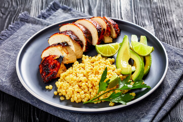 grilled chicken breast with ptitim, avocado, lime