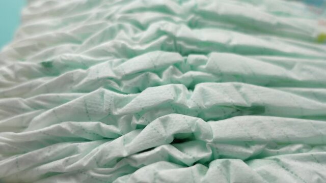 stack of baby diaper on table,
