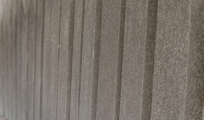 The background of a concrete barrier wall from the sea waves on the coast.