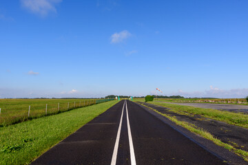 The main road past the traditional French village of Saint Sylvain in Europe, France, Normandy,...