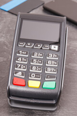 Payment terminal, credit card and smartphone. Cashless paying for shopping. Finance concept