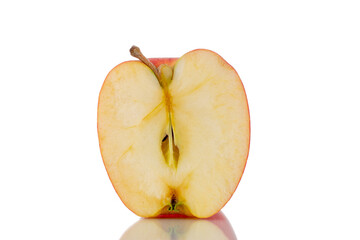 One half of an organic red apple, close-up, isolated on white.