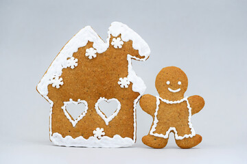 Romantic gingerbread house and smiling man, Christmas time