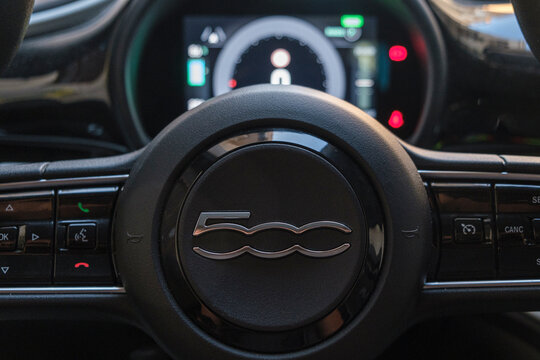 The dashboard and steering of the new fiat 500e full electric car - illustrative editorial