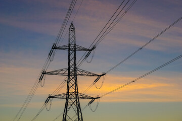 Electricity pylon and colorful sunset sky