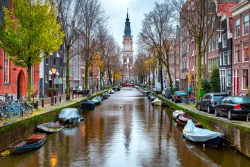 Foto auf Leinwand Rainy Amsterdam canal Groenburgwal with Zuiderkerk, southern church, Holland, Netherlands. © Kavalenkava