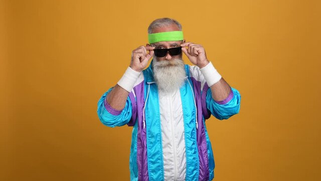 Middle aged man selfish cross arms touch specs isolated bright color background