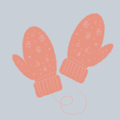 beige mittens with an ornament on a blue background