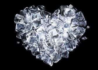 Heart made from ice cubes isolated on black background.