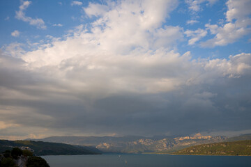 The panoramic view of the Lac de Sainte-Croix with clouds in Europe, France, Provence Alpes Cote dAzur, Var, in the summer, on a sunny day.