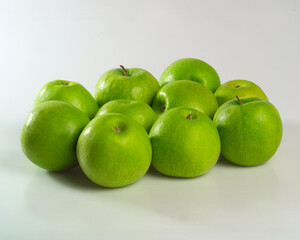 Green apples on a white isolated background. Antonovka apples for a healthy diet. Food and drink concept.