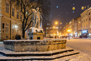 Neptun fountain in Lviv  in winter at night © Ruslan