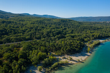 Forests at the edge of Lake Sainte-Croix in Europe, France, Provence Alpes Cote dAzur, Var, in summer, on a sunny day.