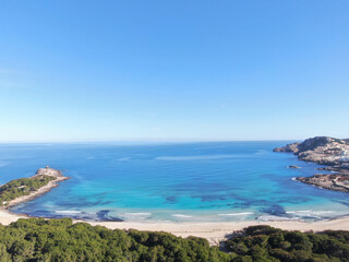 Fototapeta na wymiar Cala Agulla Mallorca. Aerial view of the seacoast of the beach in Mallorca with torquoise water colour. Amazing photo of the beach. Concept of summer, travel, relax and holiday and vacation