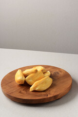 Ripe Jackfruit (Nangka) Flesh on Wooden Board, Ingredient Preparation Making Es Campur or Es Teler, Indonesian Dessert for Ramadan Breaking the Fast. Copy Space for Text