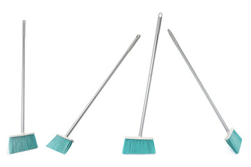 Set with plastic brooms on white background