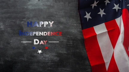 Fototapeta premium Happy independence day inscription. American flag on a chalkboard. USA holiday concept