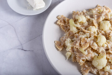 Pasta with cauliflower and goat cheese.