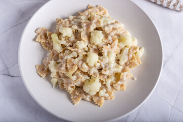 Pasta with cauliflower and goat cheese.