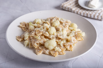 Pasta with cauliflower and goat cheese.