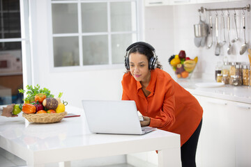 African American woman person using laptop computer to working in business at home