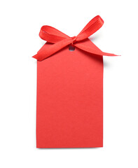 Blank red gift tag with satin ribbon on white background, top view