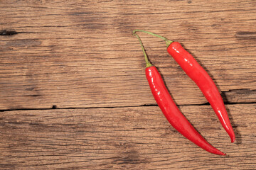 Red chili on wood background.