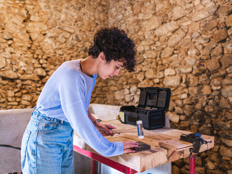 Female artisan using dapping set
