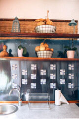Open space kitchen interior. Sink and shelves with fruits. Rustic style kitchen interior. Close up