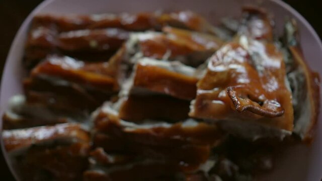 suckling whole small pig pork crispy skin Chinese delicacy dish