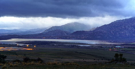 Aerial view of the mountains of Madrid at sunset on cloudy day. Manzanares Real, Madrid.