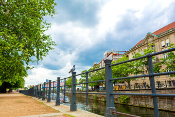 A river channel in a European city. Great sunny day for walking