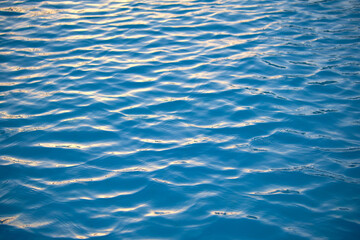 Closeup seascape surface of blue sea water with small ripple waves